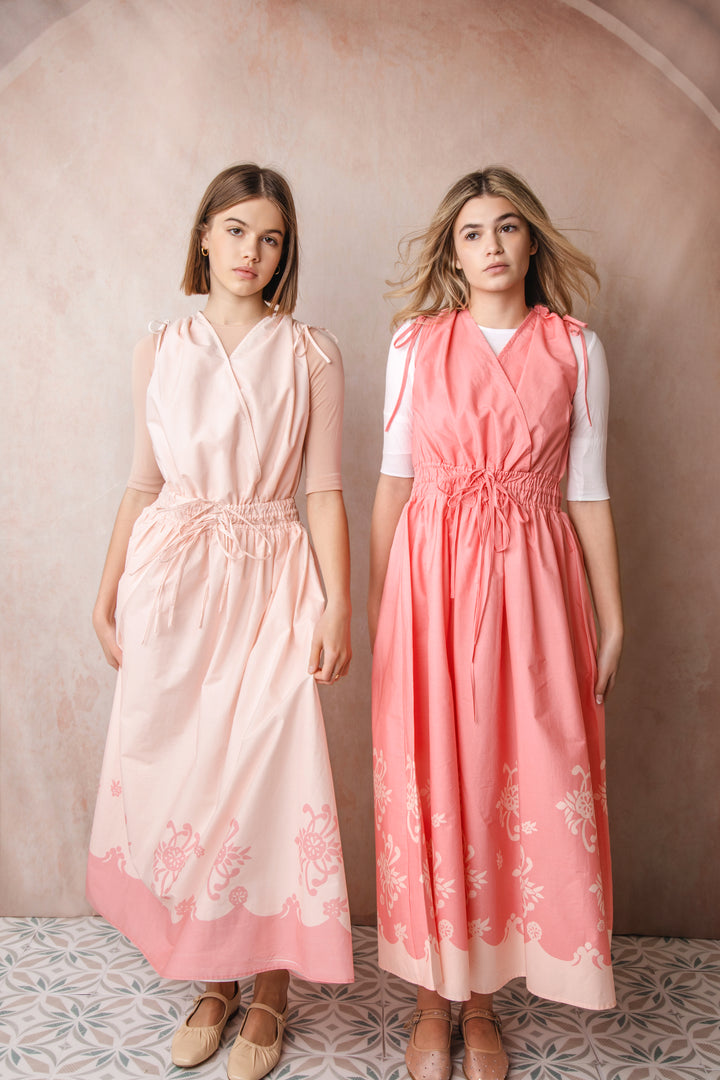 HDR605-SHOULDER AND WAIST PULLY STRINGS DRESS WITH HEM BORDER PRINT-Pink